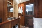 Laundry room also has a sink and shower area, perfect for a rinse after a surf or beach walk